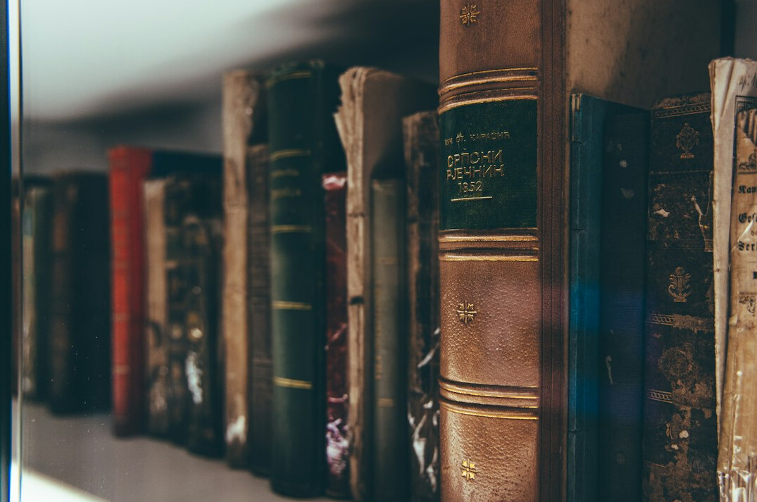 Shelf of old hardcover books