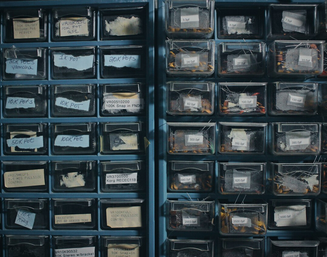 Sorted collection items in small boxes with labels