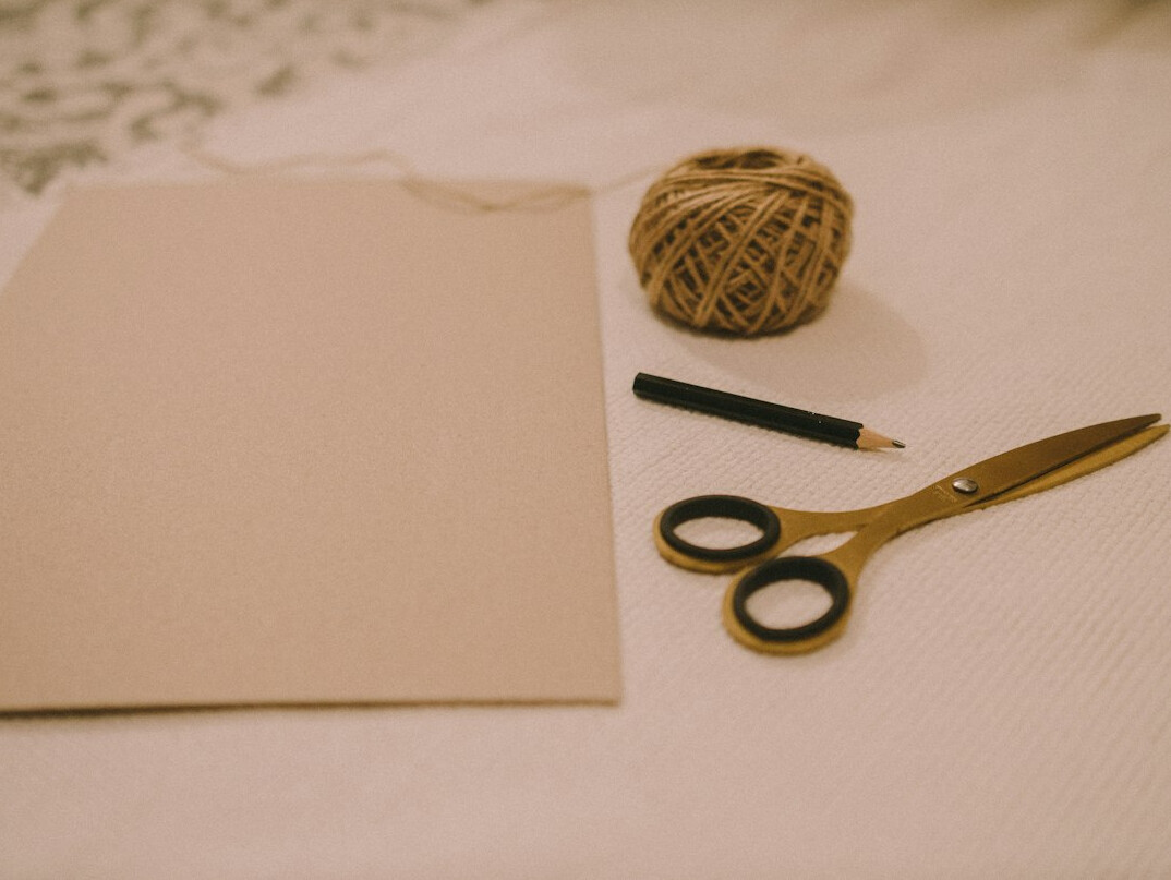 Simple handmade crafts with paper, thread and scissors