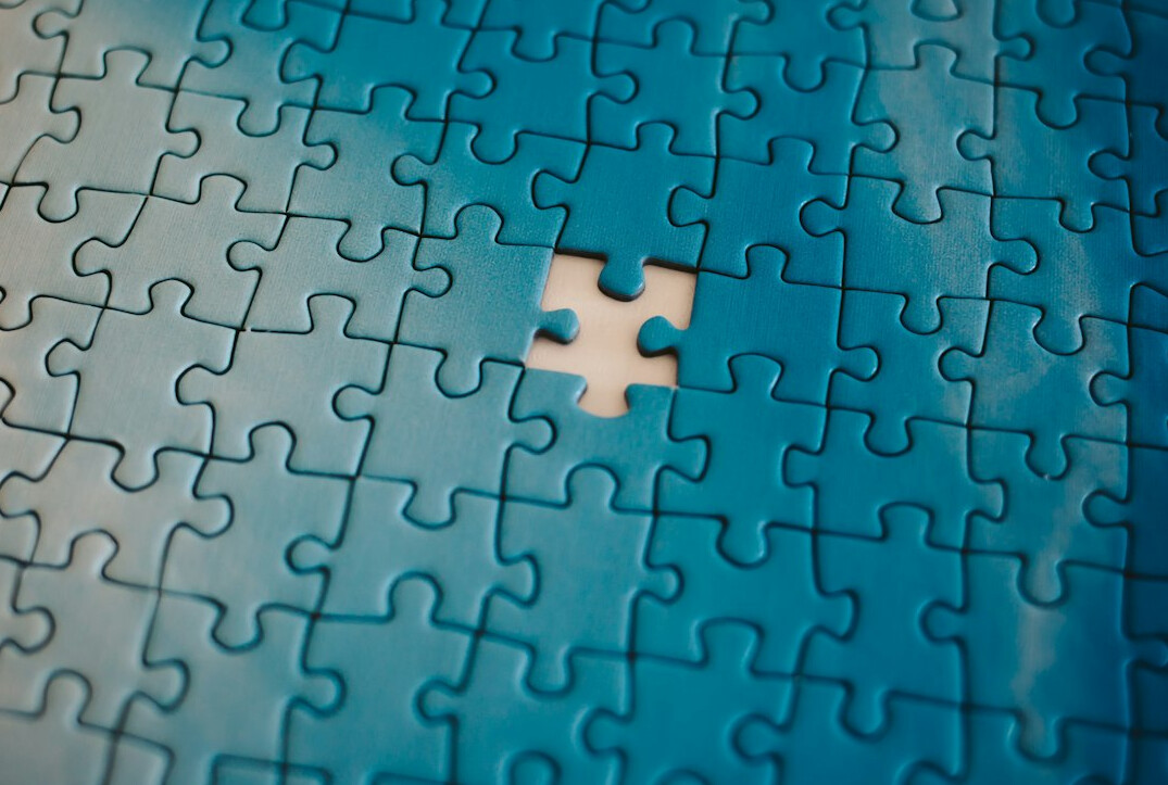 Jigsaw puzzle in progress next to a board game
