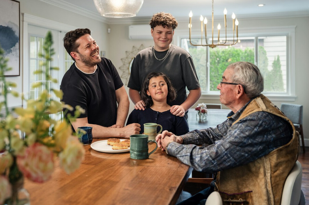 family gathering around table