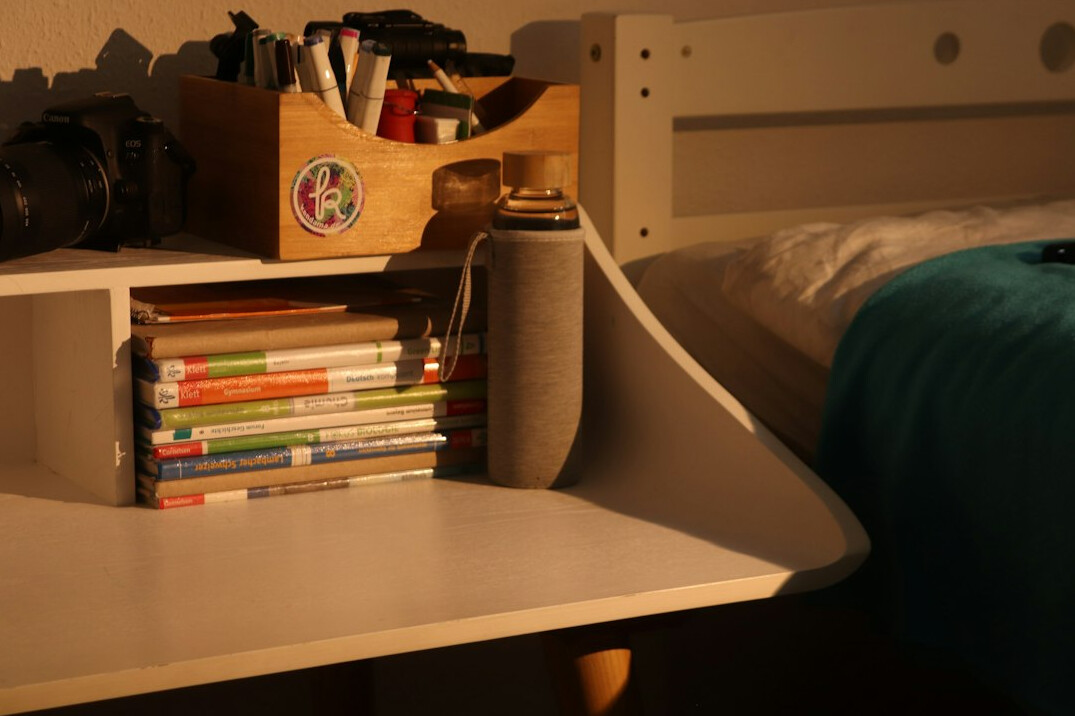 Overhead view of a hobby desk with albums and notes