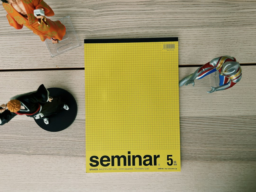 Printed beginner guides and a notebook on a desk